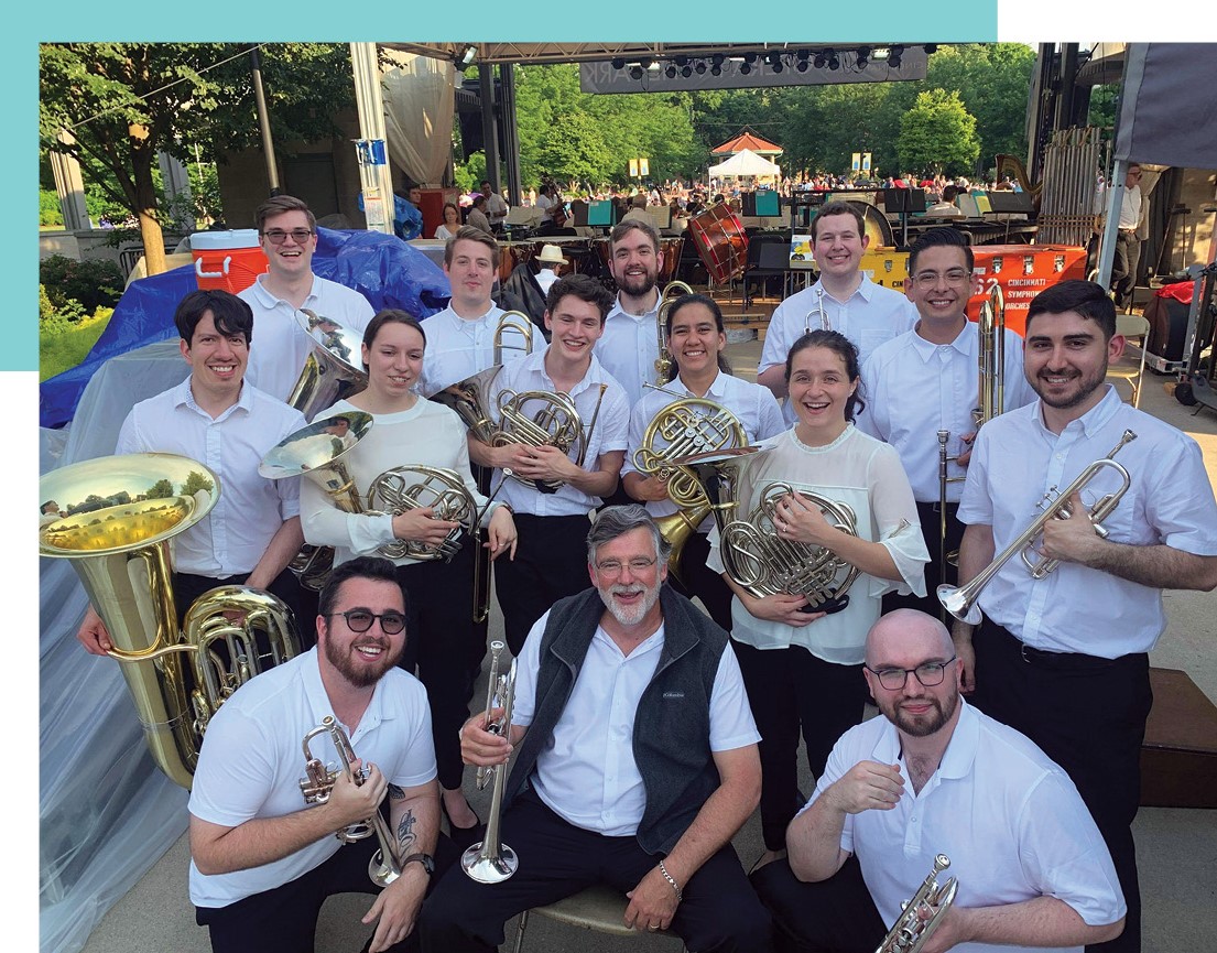 High School Scholars and Orchestral Training Fellows pose with Associate Principal Trumpet Douglas Lindsay after a performance, June 2022.  Credit: Josh Stenger