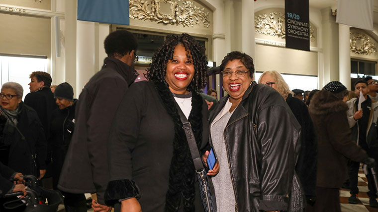 Classical Roots concert attendees posing for a photo in the lobby