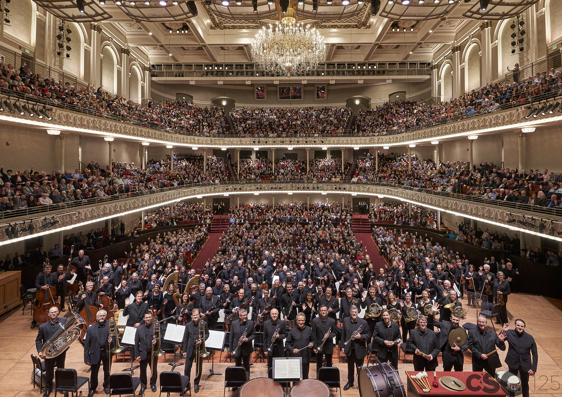 Photo of Orchestra and audience in Music Hall for 125th Anniversary